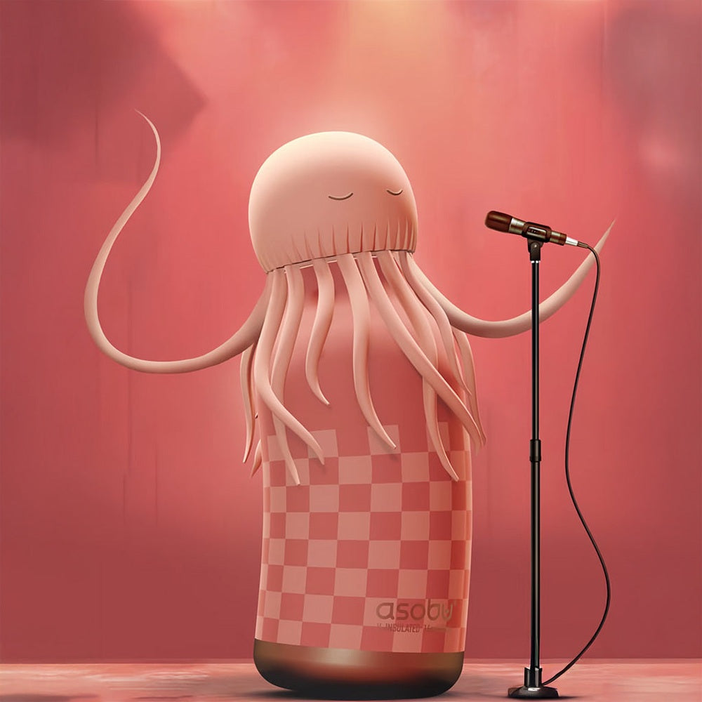 ASOBU Bestie Animal 16oz Jellyfish Pink double-wall stainless steel bottle on stage, singing into a mic.