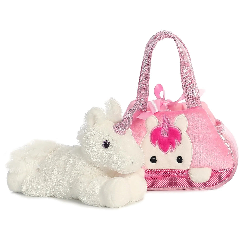 Aurora Fancy Pals Peek-A-Boo Unicorn 7in plush beside a pink sequined purse, ready for cuddles.