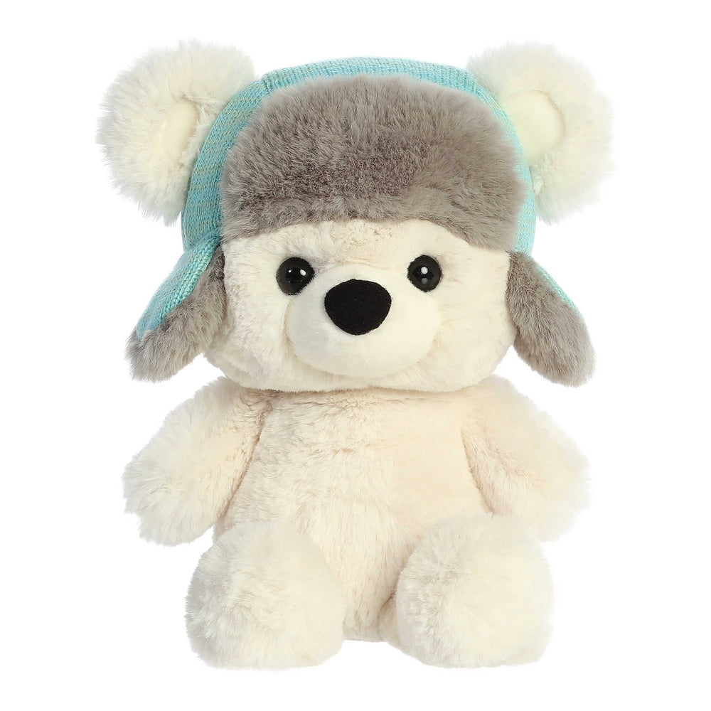 Aurora Benny 13in plush bear with cream fur and gray cap wearing a blue knit aviator hat.