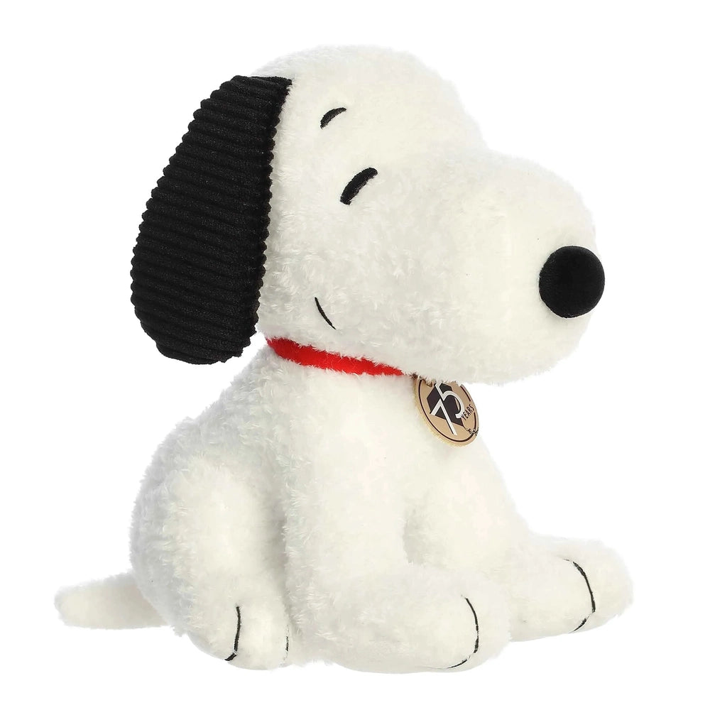 Aurora Peanuts 75th Anniversary Snoopy 10-inch stuffed animal, white with black ears and red collar.