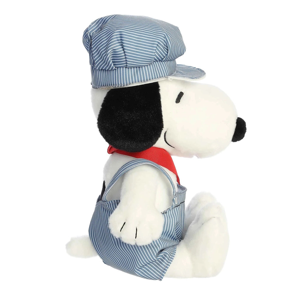 Aurora Snoopy Train Engineer stuffed animal wearing blue striped overalls and cap with a red scarf.