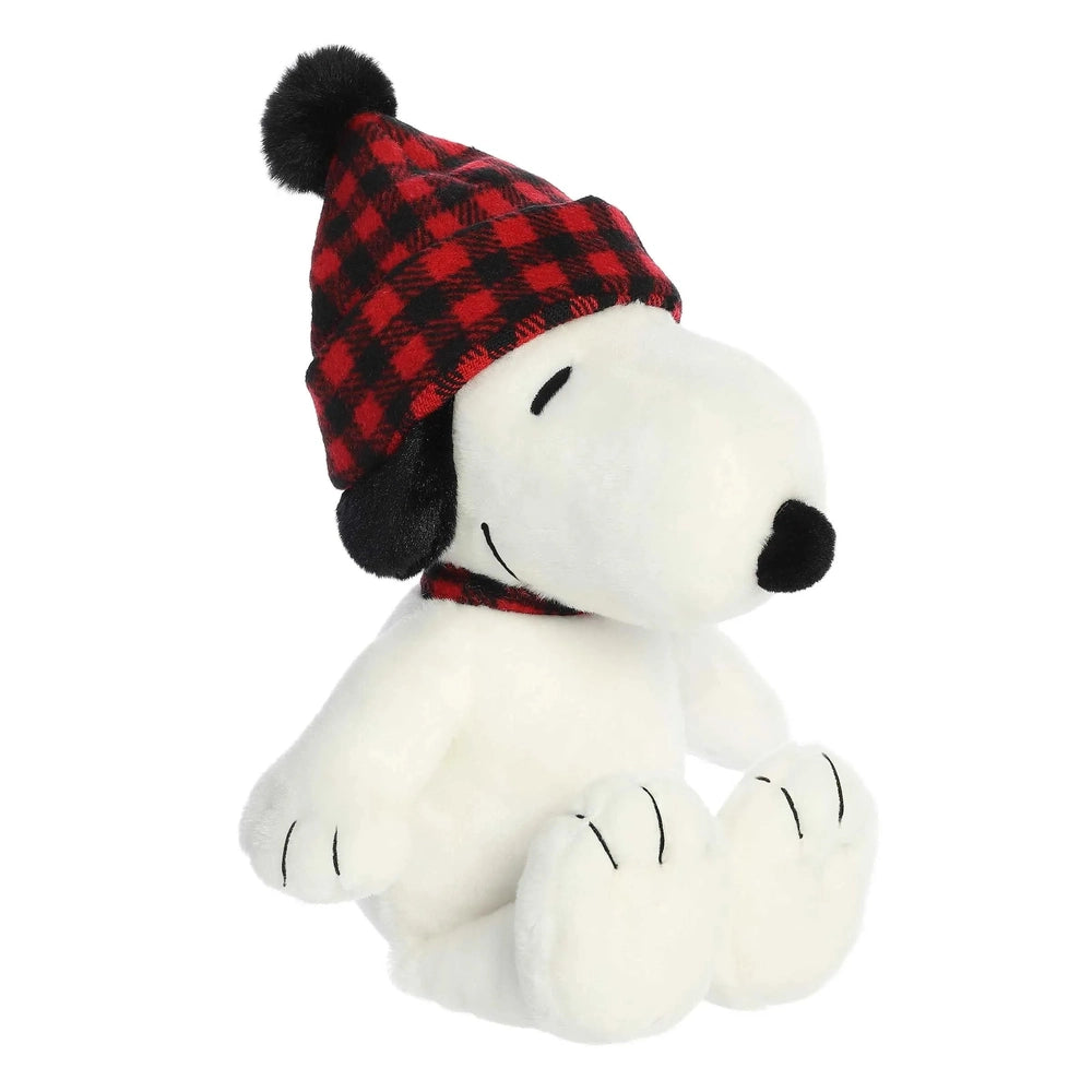 Aurora Snoopy 11-inch stuffed animal wearing a red plaid knit hat with a black pom, cozy white plush toy.