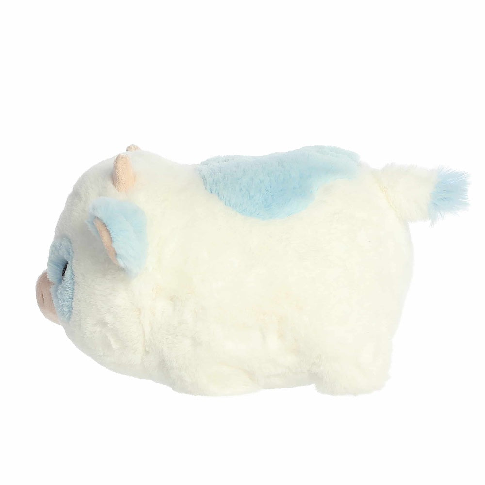 Aurora Spudsters Bonnie Blueberry Cow plush toy, white with blue patches and fluffy tail.