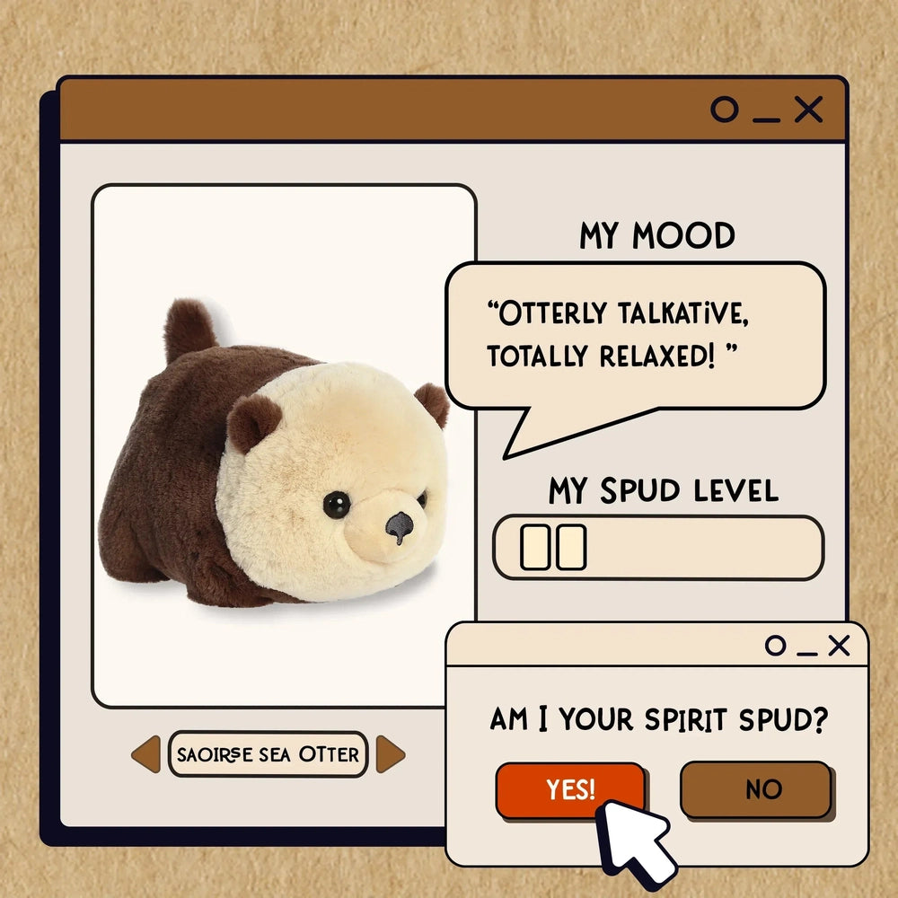 Aurora Spudsters Saoirse Sea Otter 10" plush; brown body, cream face, shown ready for hugs in a toy display.