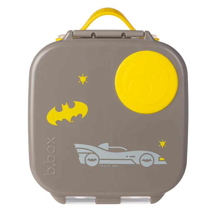 B.BOX Mini Lunchbox in taupe with bright yellow lid and Batman car graphic, carried by its yellow handle.