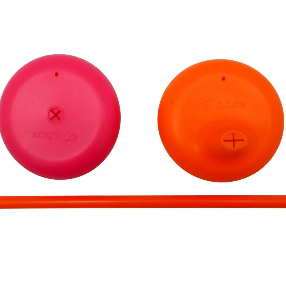 B.Box Silicone Lids Travel Pack: pink and orange lids with straw laid out for portable mealtime.