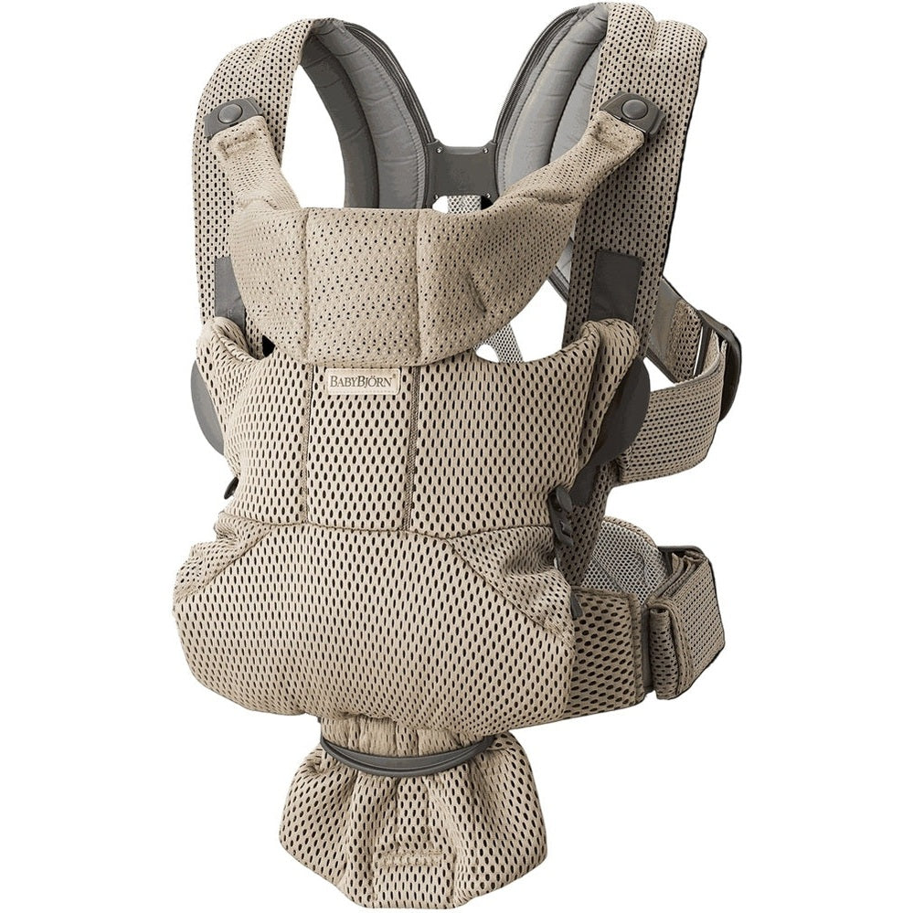 BabyBjörn Baby Carrier Free in beige mesh worn on an adult, showing padded shoulders and supportive waist belt.
