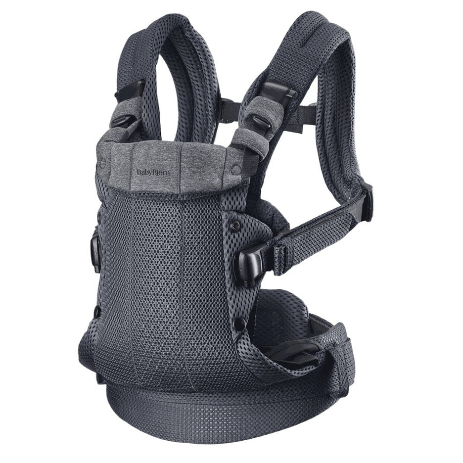 BabyBjörn Baby Carrier Harmony in gray mesh worn on a parent with padded straps and buckles.
