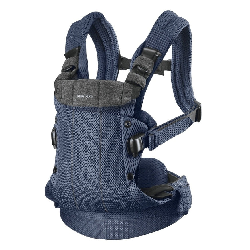 BabyBjörn Harmony baby carrier in navy blue mesh with padded straps and waist belt for comfortable front carry.