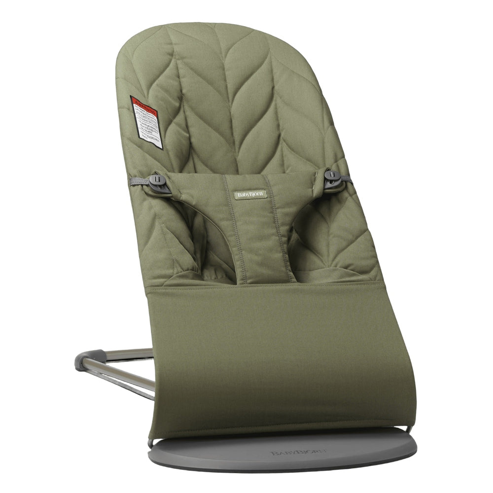 BabyBjörn Bouncer Bliss in olive green, attached to its metal stand with a quilted seat and safety harness.