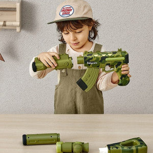 BC Babycare Kids Magnetic Toy Gun Kit; green plastic toy gun with detachable parts, child playing.