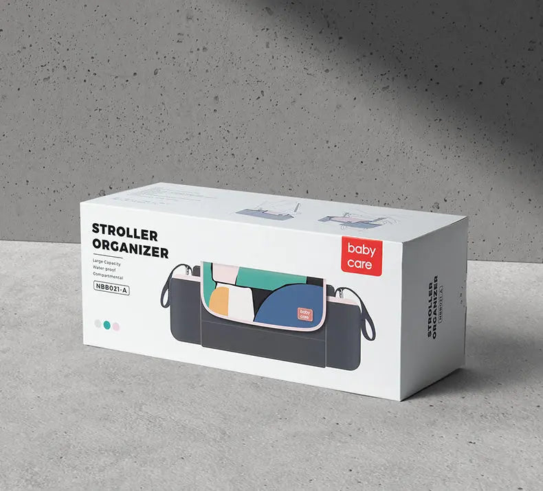 BC Babycare Stroller Organizer on a concrete surface, dark gray with color-block interior and detachable straps