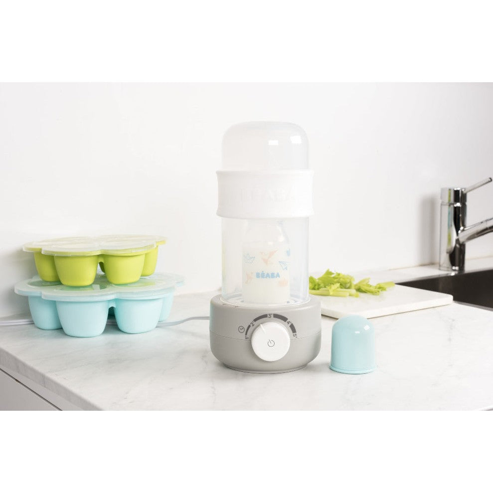 Beaba Ultra Fast Bottle Warmer Cloud with bottle inside on gray base