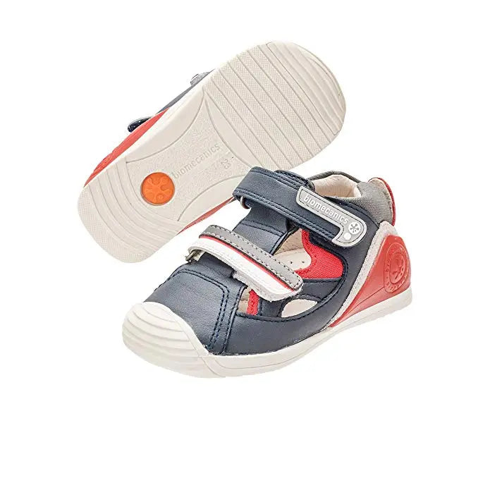 Biomecanics A Azul Marino toddler sandals with navy upper and red accents, Velcro straps fastened.