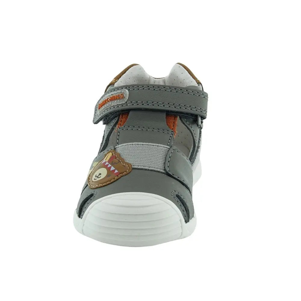 Biomecanics Sandals Tundr toddler sandal in gray with Velcro strap fastened and a dinosaur patch.