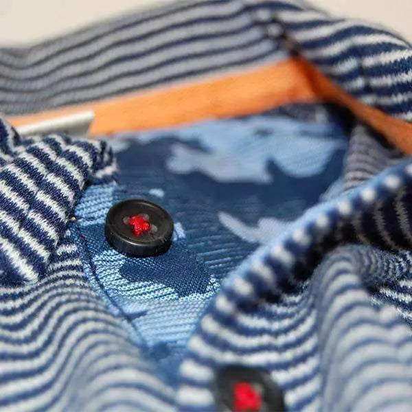 Bit'z Kids Polo Shirt Navy Blue stripes; close view shows a black button fastened with red thread at the collar.