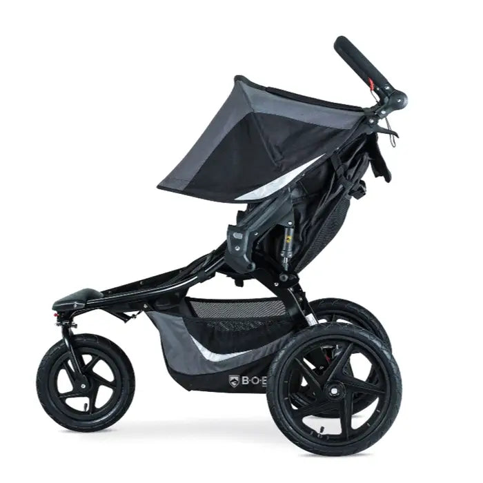 Bob Revolution Flex 3.0 Duallie Stroller in black/gray, two-seat design with large wheels and adjustable canopy.