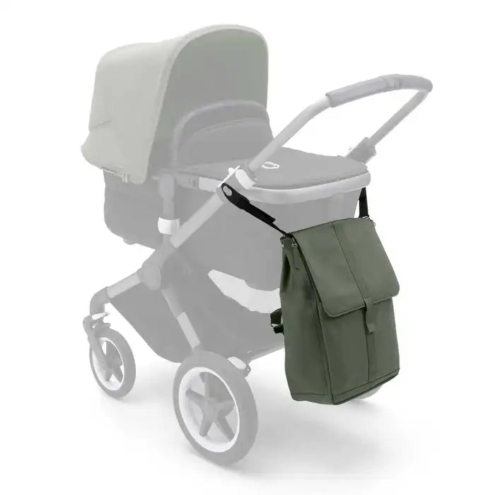 Bugaboo Changing Backpack in olive green attached to stroller handle for on-the-go diaper storage.