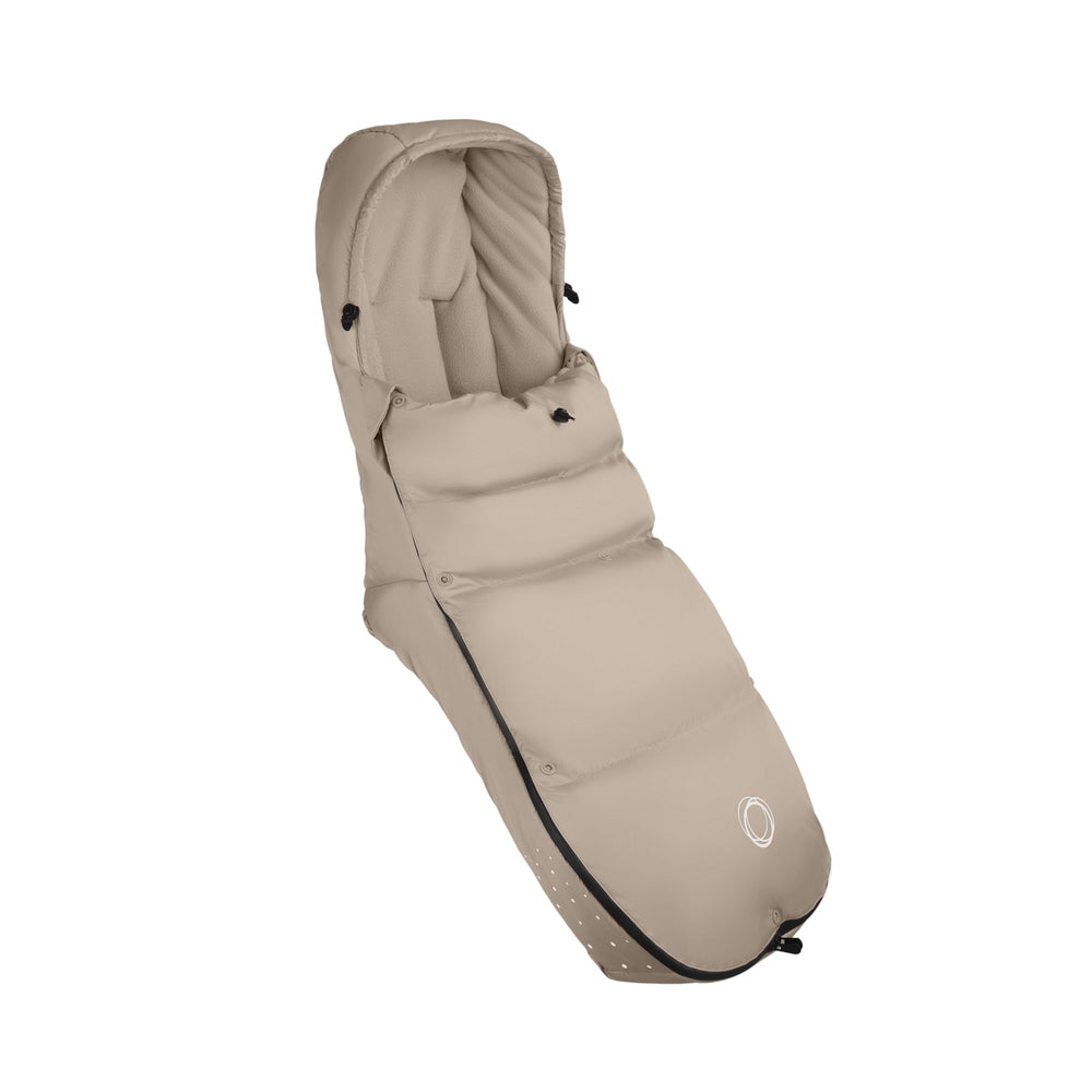 BUGABOO THERMOLITE Performance Footmuff in beige, snugly lining a baby stroller seat for winter strolls.