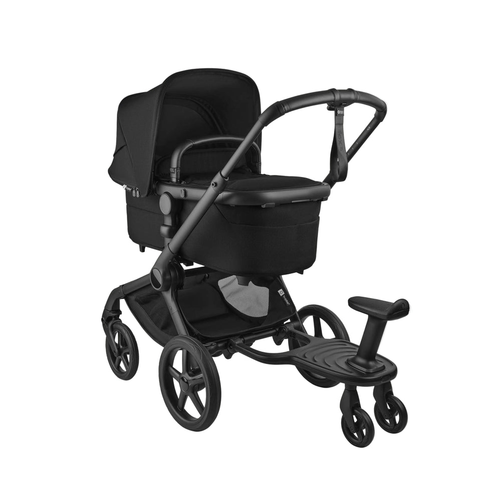 Bugaboo Wheeled Board attached to a black Bugaboo stroller, offering a standing riding platform beside the pushchair.