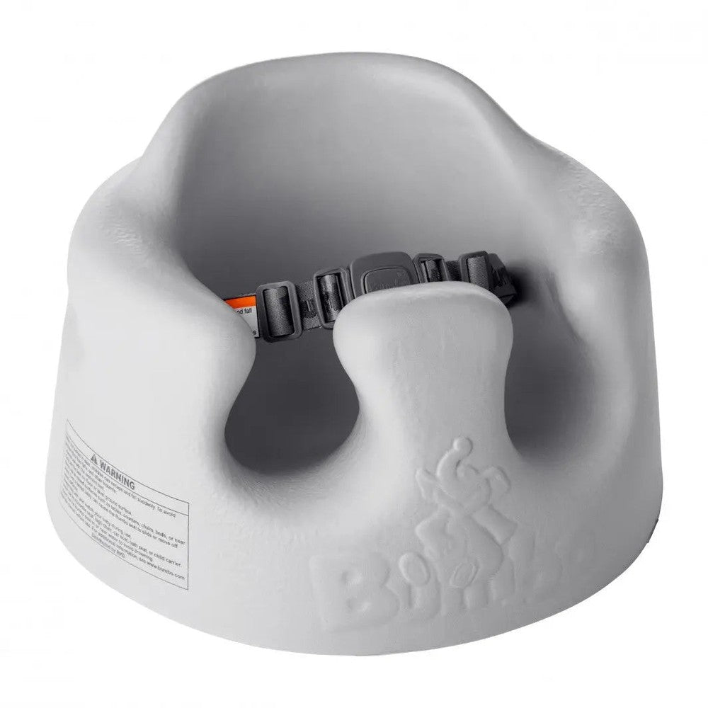 Bumbo Floor Seat gray with securing safety strap, showing molded compact infant booster.