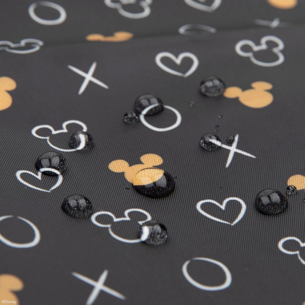 Bumkins Disney SuperBib 3-pack Love Minnie bib set on a dark Mickey-patterned background