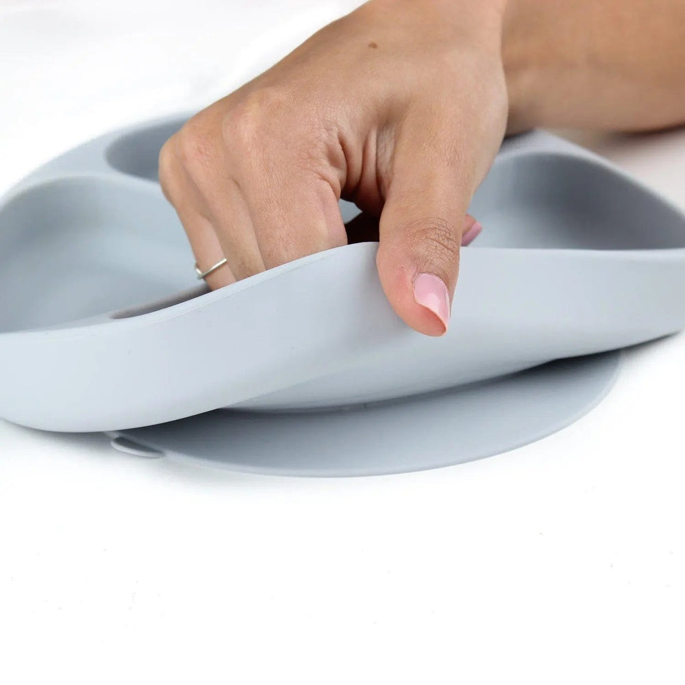 BUMKINS Silicone Grip Dish gray with suction base; hand lifts the plate for mess-free baby feeding.