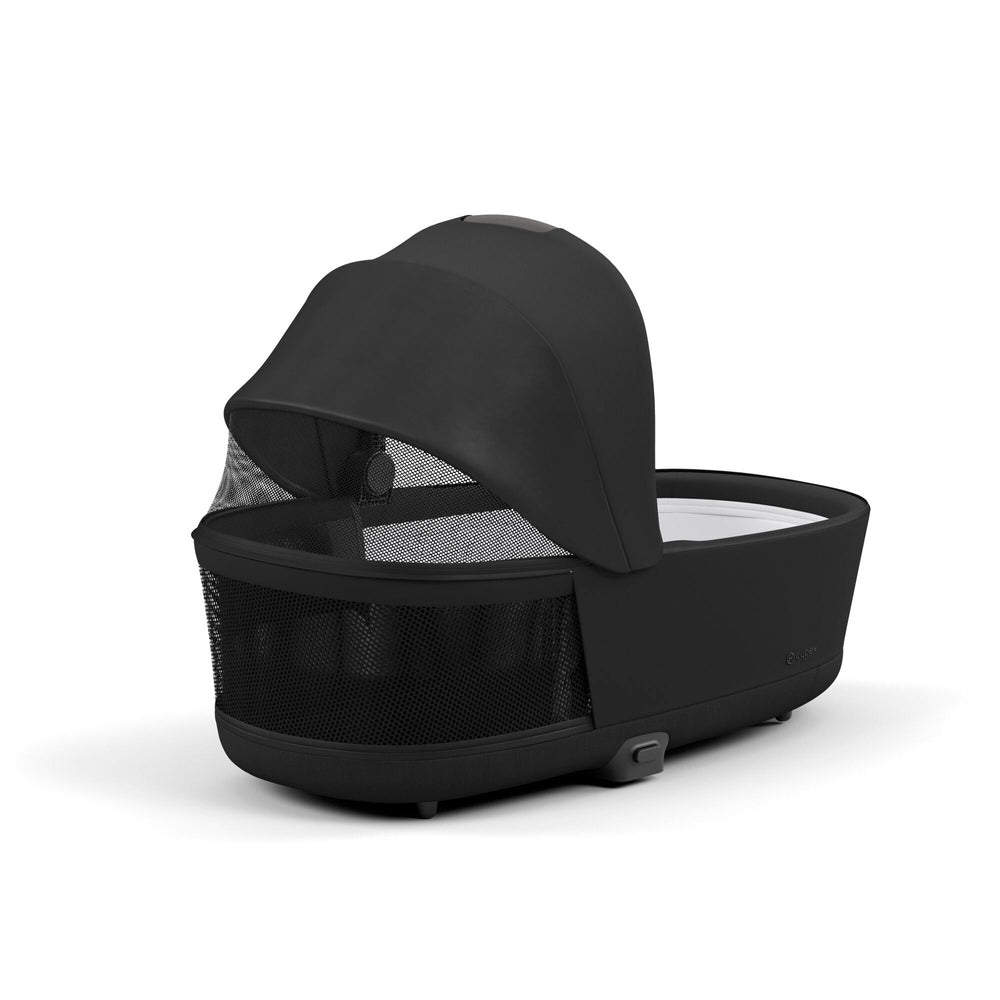 CYBEX e-Priam Chrome Frame/Deep Black Lux Carry Cot bundle; a black stroller bassinet attached with mesh sides and extended canopy.