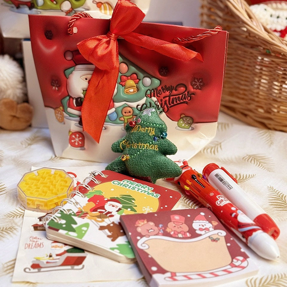 Christmas Stationery Gift Bag by baby enRoute, red bag with bow showcasing Santa designs and a festive stationery set.