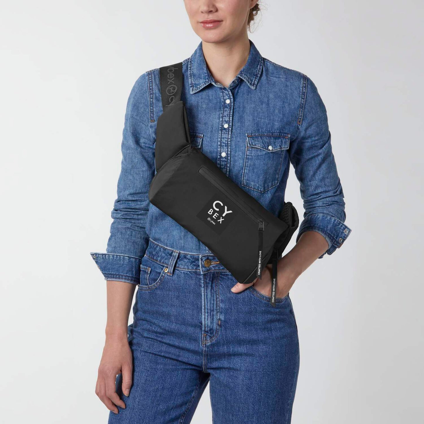 Cybex Coya Carrier black crossbody with logo strap for hands-free baby transport