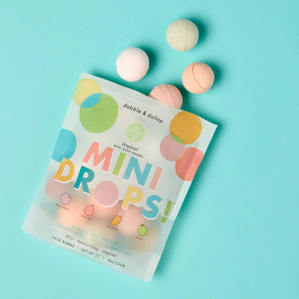 Dabble & Dollop Mini Drops Bath Bombs all-natural tropical scents in a pastel bag, five pastel bath bombs spilled beside it