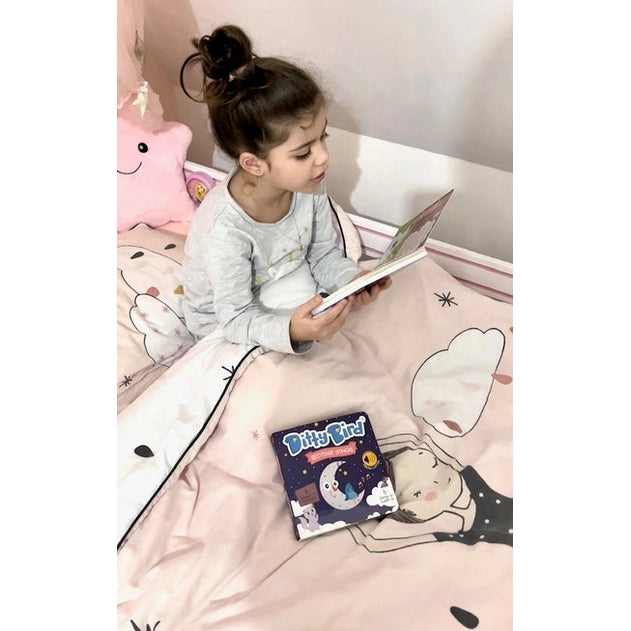 Ditty Bird Sound Book Bedtime Songs USB-C Rechargeable, girl sits on pink bed reading the book.