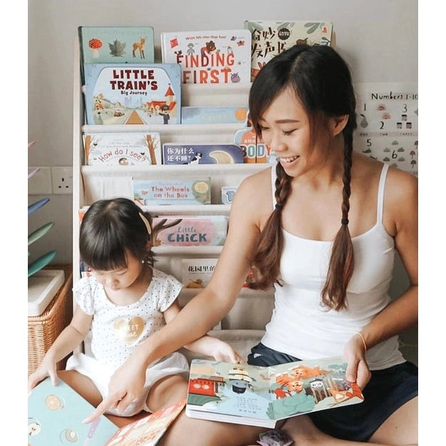 Ditty Bird Sound Book Chinese Songs USB-C Rechargeable used by a mother and child reading together in a cozy corner.
