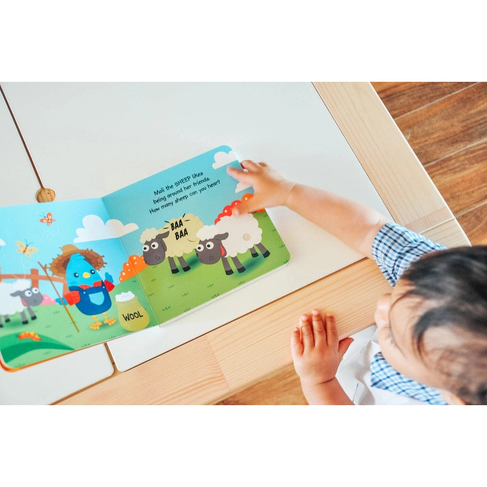 Ditty Bird Sound Book Farm Animal USB-C Rechargeable; child flips open a colorful farm page with sheep sounds.