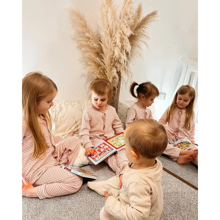 Ditty Bird Sound Book First 100 Words USB-C Rechargeable being read by five children in a cozy nursery