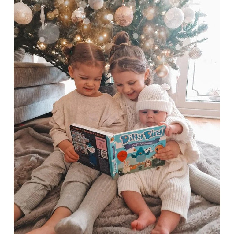 Ditty Bird Sound Book First Sensory Book Cute Animals; three kids reading under a festive Christmas tree.