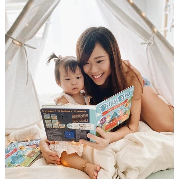 Ditty Bird Sound Book Happy Birthday USB-C Rechargeable read by a mom and toddler inside a cozy tent.
