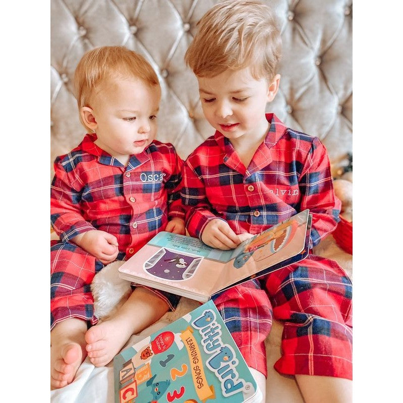 Ditty Bird sound book learning songs; two kids in red plaid pajamas reading colorful pages