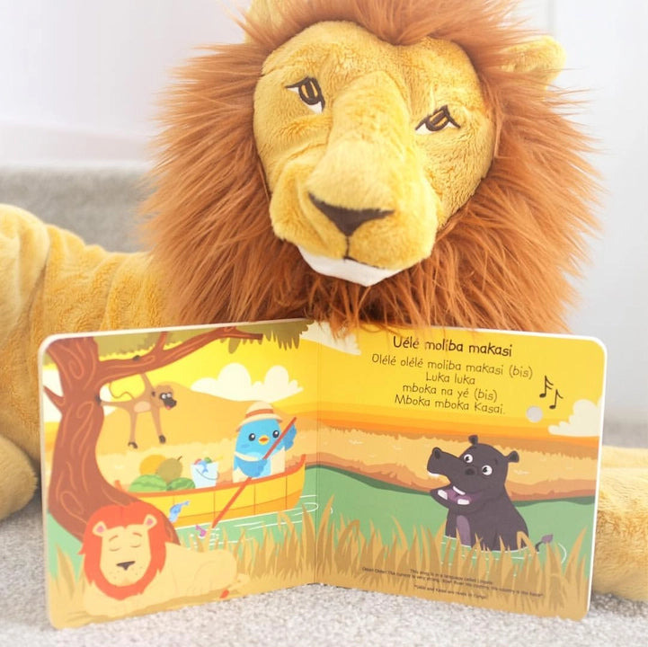 Ditty Bird Safari Animal Sounds USB-C Rechargeable; a plush lion holds an open colorful animal-safari book.