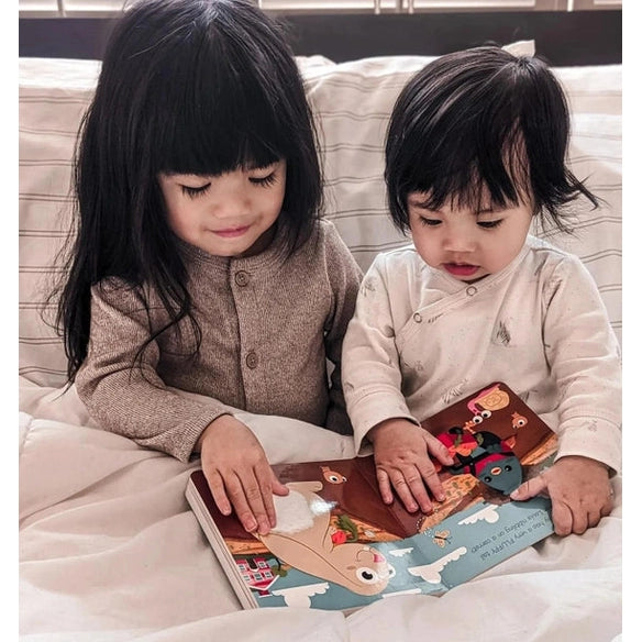 Ditty Bird Sound Book Touch The Cute Animals USB-C Rechargeable, two toddlers cozy reading the interactive sound book.