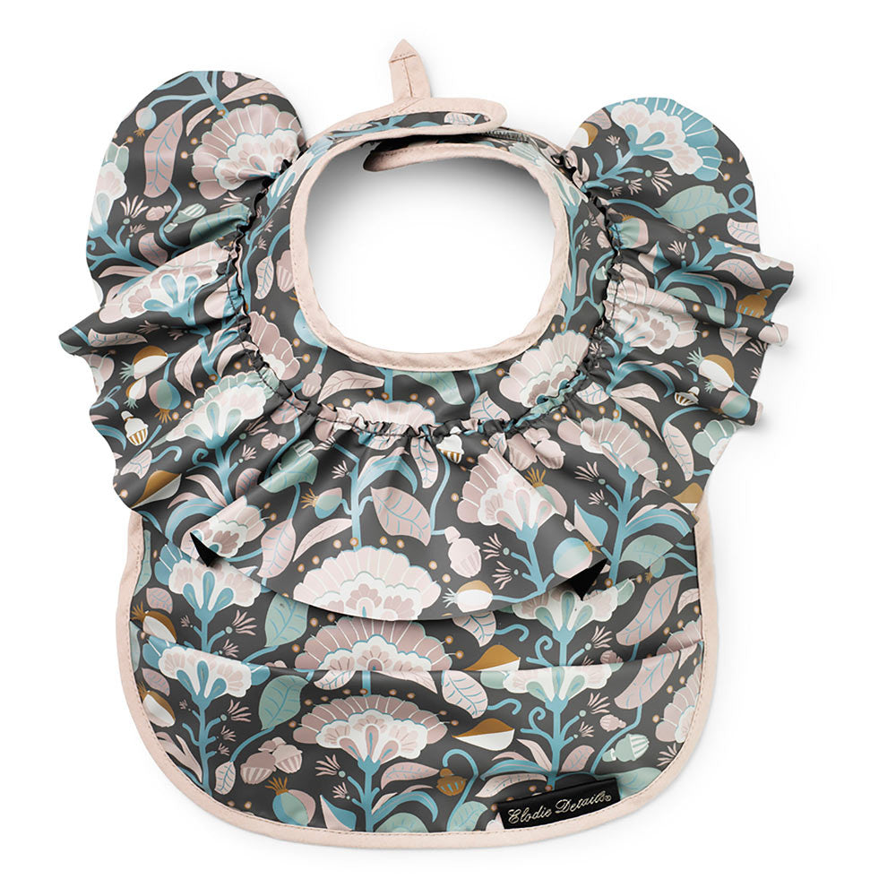 Elodie Details baby bib Midnight Bells with floral ruffle on dark gray background in pastel greens pinks blues