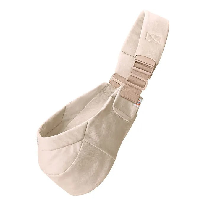 Ergobaby Upsie Sling Carrier beige, with adjustable buckled strap and soft fabric.