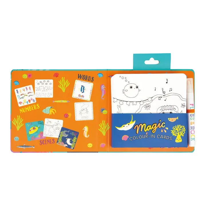 Floss And Rock Magic Color-In Cards Ocean set opened to bright orange activity pages and a blue card pack.