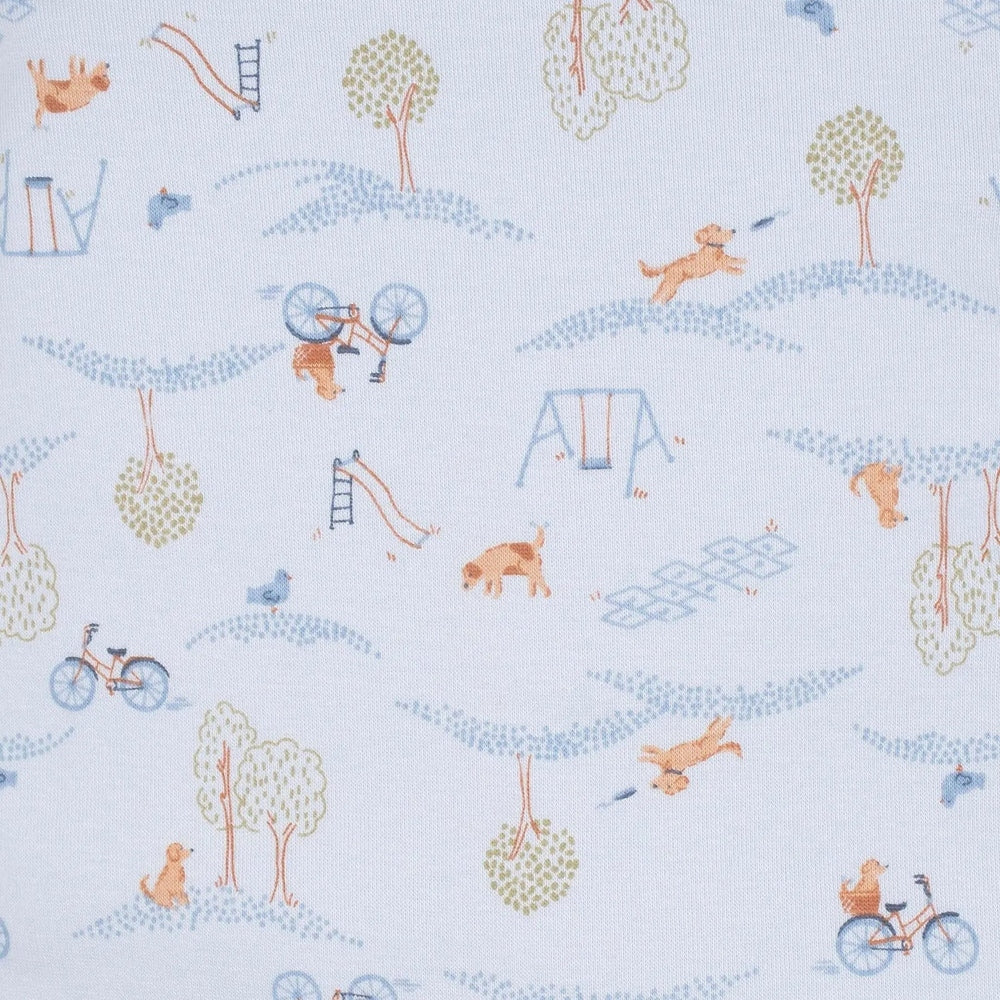 Gerber Baby Boy Puppy Playground Blue fabric showing puppies riding bikes beside swings and trees.