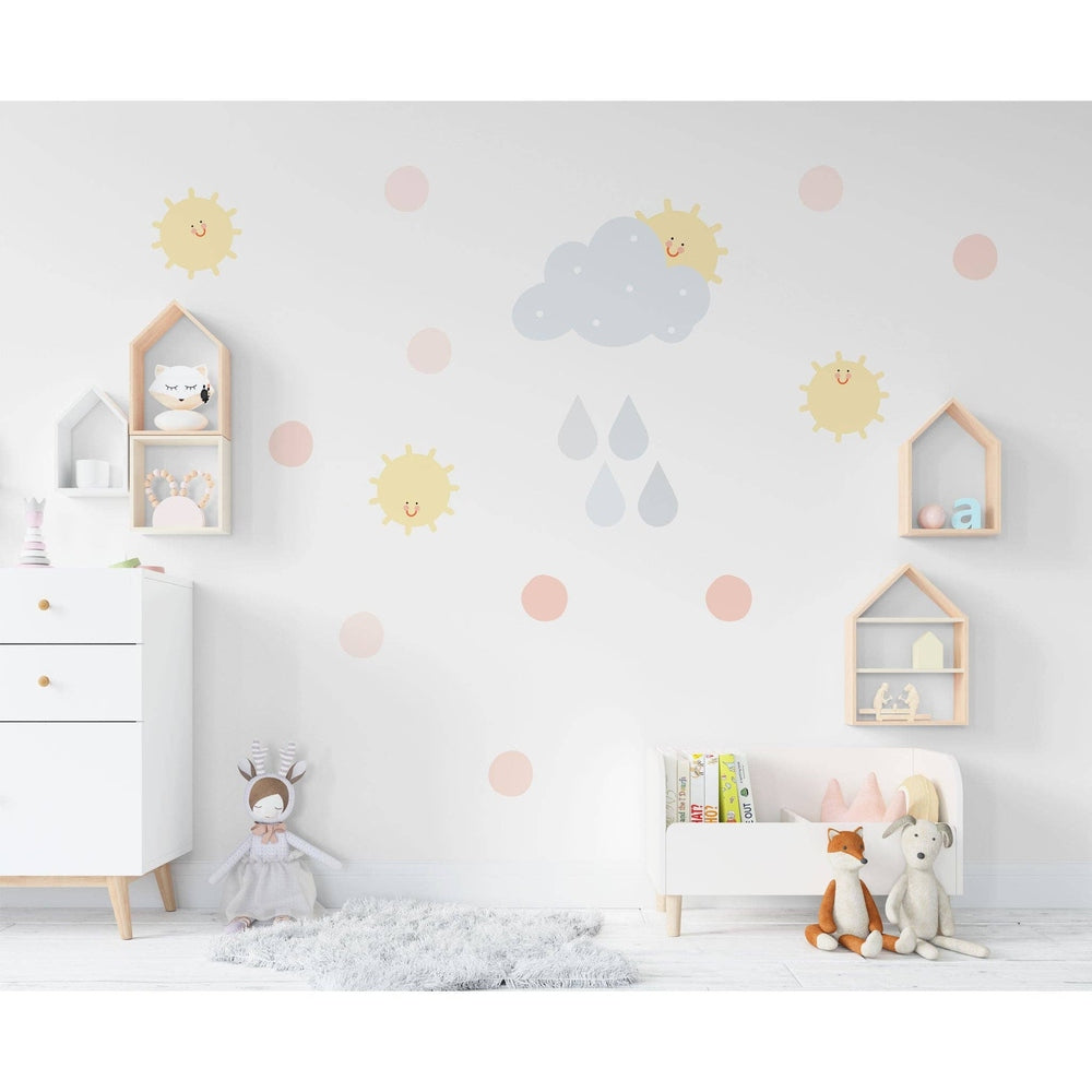 Hello Beautiful Designs sun and rain cloud nursery wall decals set in soft pastels with pink dots.