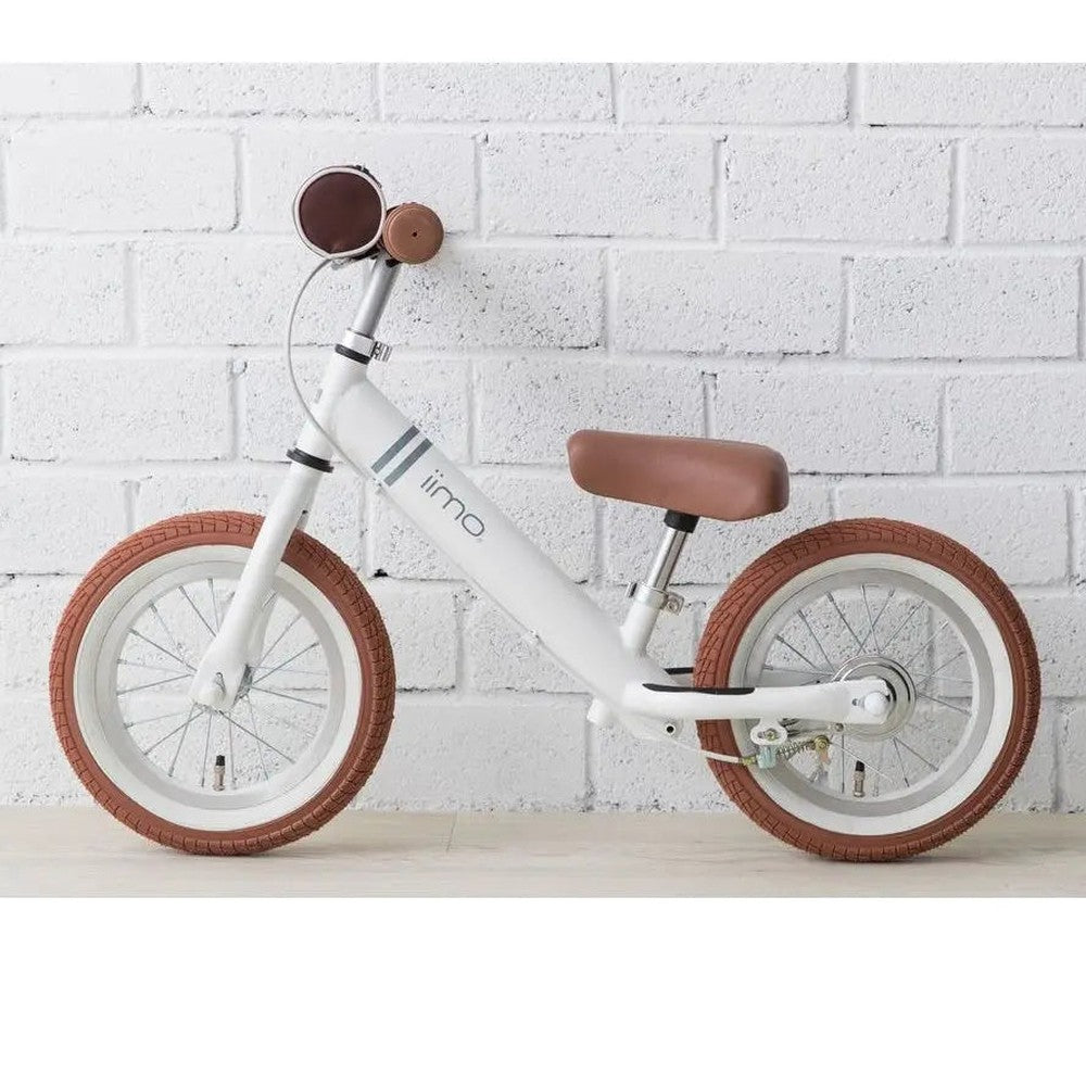 Iimo Balance Bike, white frame with brown saddle and tires, ready for toddlers' first ride.