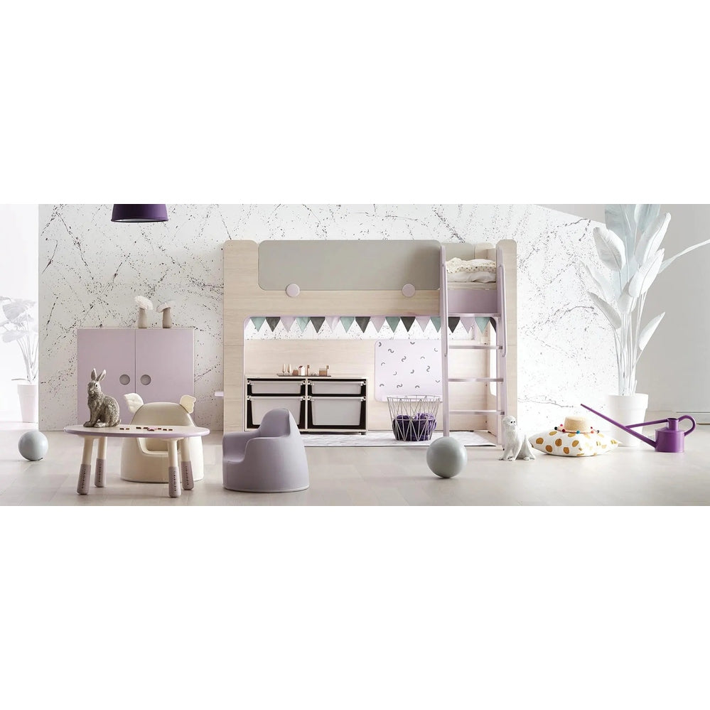Iloom Cabin Bunk Bed (Ladder Type) in light wood with lavender ladder; toddler climbs to the top bunk.