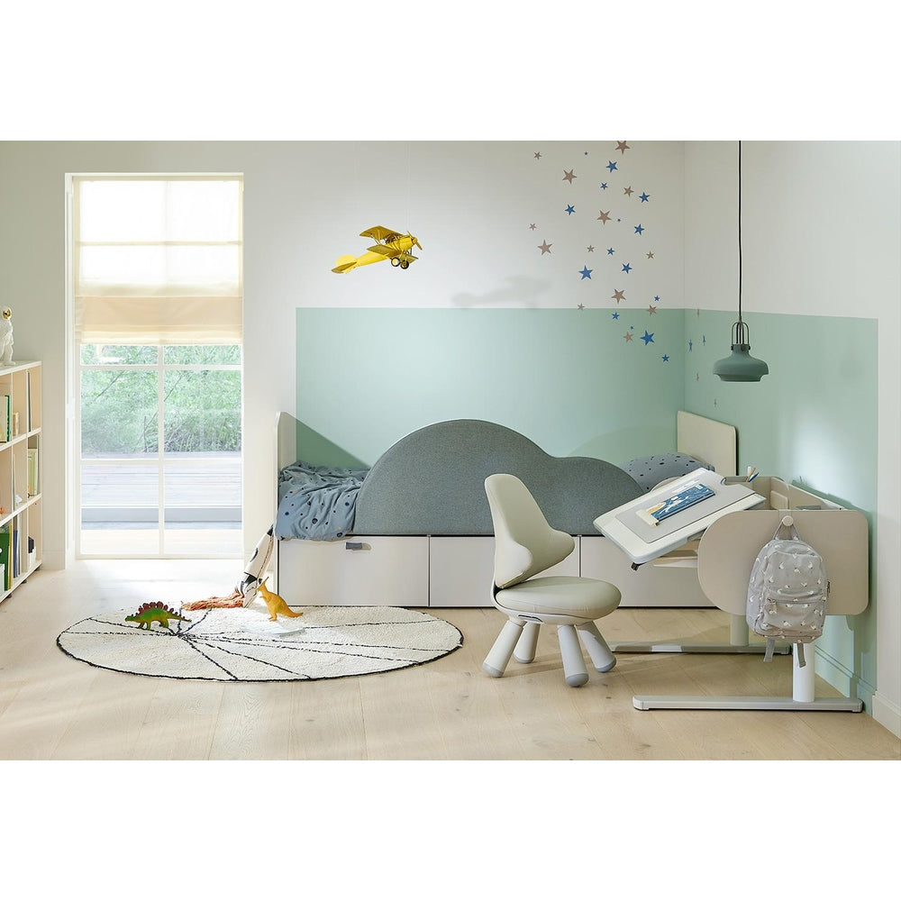 ILoom Eddi Kids 6-Story Bookshelf 950W in white with cubbies filled with books in a bright child's room.