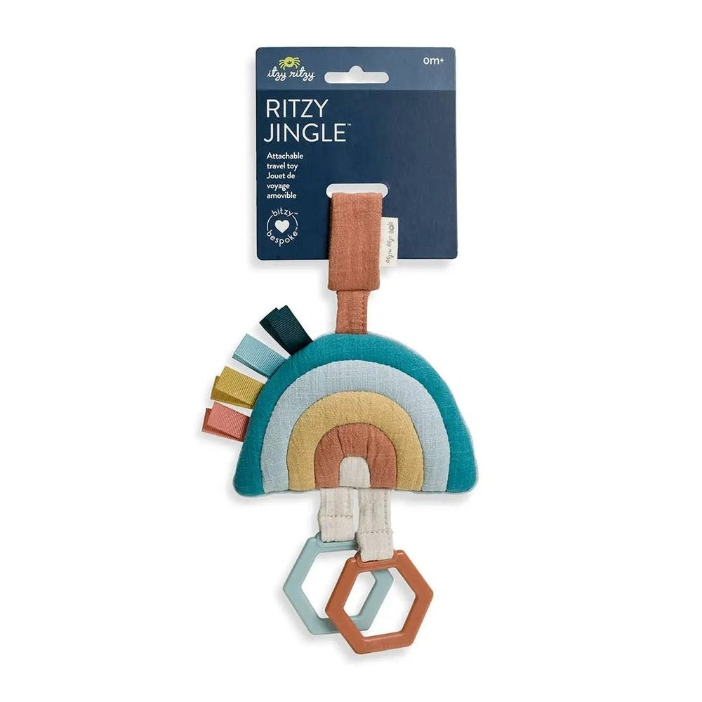 Itzy Ritzy Bitzy Bespoke Ritzy Jingle Attachable Travel Toy: teal rainbow teether with pastel arches and ribbons.