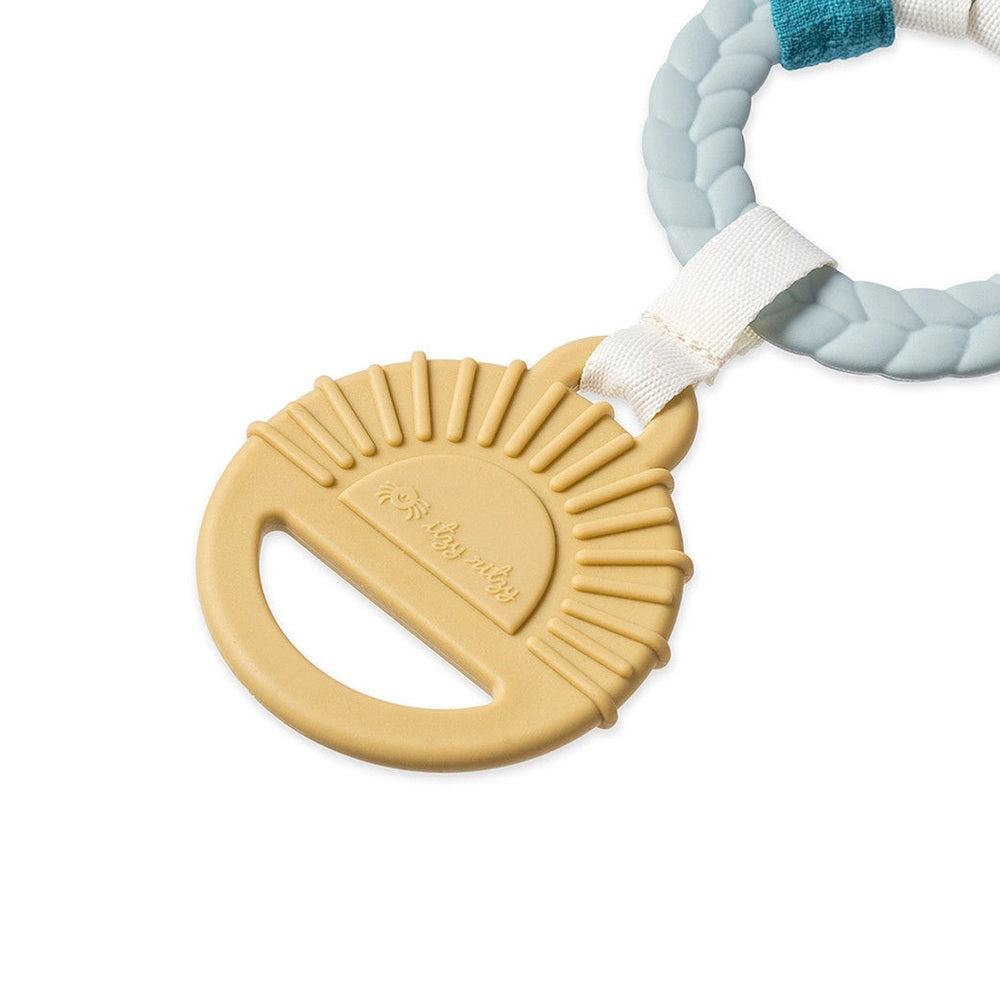 Itzy Ritzy Bitzy Busy Gift Set teether with a beige sunburst ring on a braided aqua strap